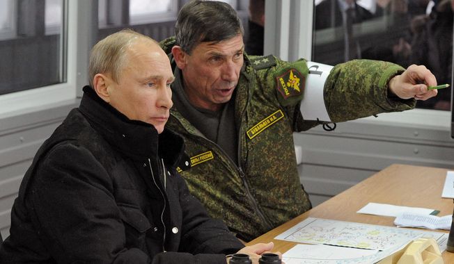 Russian President Vladimir Putin, listens to Gen. Ivan Buvaltsev, right, as they observe a military exercise near St. Petersburg, Russia, Monday, March 3, 2014.  pro-Russian troops held all Ukrainian border posts Monday in Crimea, as well as all military facilities and a key ferry terminal, cementing their stranglehold on the strategic Ukrainian peninsula. (AP Photo/RIA-Novosti, Mikhail Klimentyev, Presidential Press Service)