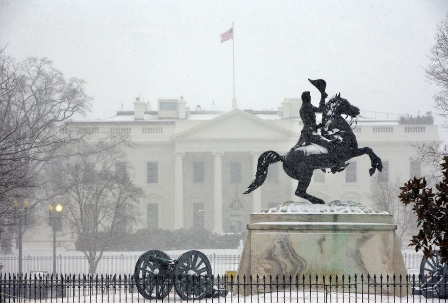 The statue of President Andrew Jackson at the Battle of New Orleans, sculpted in 1853 by Clark Mill sits in the falling snow in Lafayette Park across the street from the White House in Washington, Monday, March 3, 2014. The winter weather prompted area schools and the federal government to close and the National Weather Service has issued a Winter Storm Warning for the greater Washington Metropolitan region. (AP Photo/Pablo Martinez Monsivais)