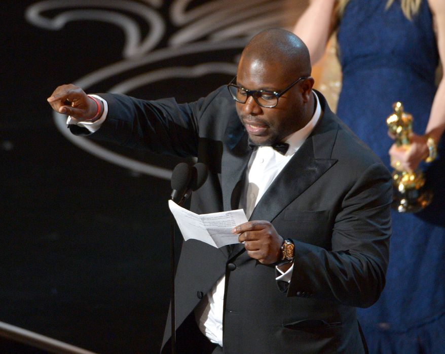 Steve McQueen accepts the award for the best picture of the year for &quot;12 Years a Slave&quot; during the Oscars at the Dolby Theatre on Sunday, March 2, 2014, in Los Angeles.  (Photo by John Shearer/Invision/AP)