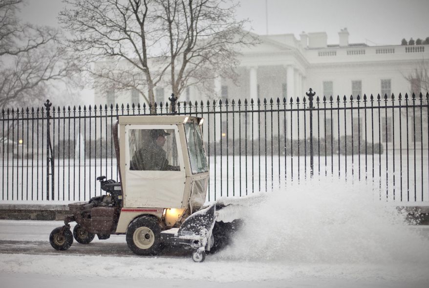 The sidewalk in front of the White House in Washington is cleared of snow, Monday, March 3, 2014. The National Weather Service has issued a Winter Storm Warning for the greater Washington Metropolitan region, prompting area schools and the federal government to close for the wintry weather. (AP Photo/Pablo Martinez Monsivais)