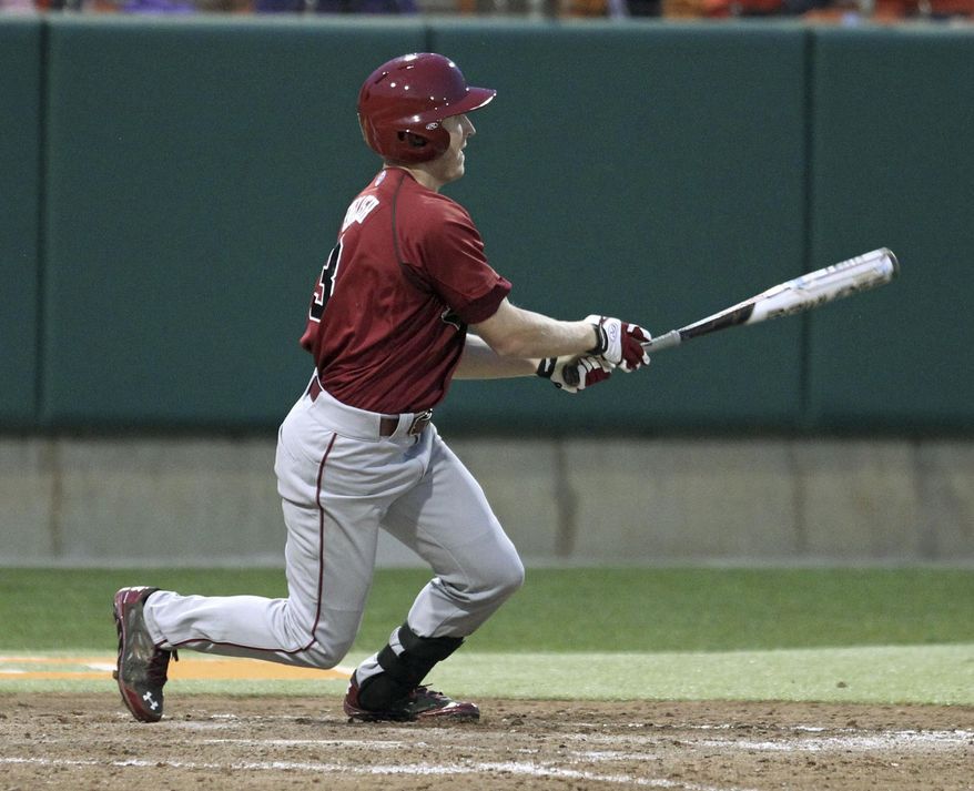 South Carolina's Tanner English watches his two-run double in the ninth inning that scored the winning runs to beat Clemson 5-3 in an NCAA college baseball game on Sunday, March 2, 2014 in Clemson, S.C. (AP Photo/Anderson Independent-Mail, Mark Crammer) GREENVILLE NEWS OUT SENECA JOURNAL OUT