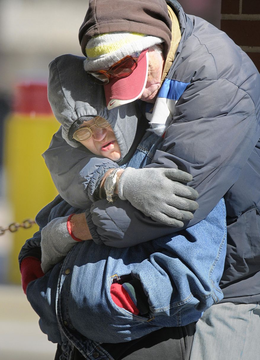Dana Maxwell, left, and Roger Saunders keep each other warm at Intermodal Transportation Center in Fort Worth, Texas, Monday, March 3, 2014. The couple said that they are homeless and had to leave the Presbyterian Night Shelter at 7 a.m. and plan to ride the bus all day to keep warm. The National Weather Service issued a wind chill advisory until midmorning Monday for the Dallas-Fort Worth area. Forecasters say sunny conditions should return by Tuesday with highs in the upper 40s. (AP Photo/The Fort Worth Star-Telegram, Max Faulkner) MAGS OUT; (FORT WORTH WEEKLY, 360 WEST); INTERNET OUT