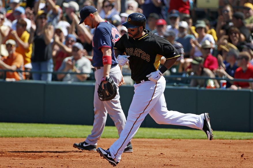 Pittsburgh Pirates' Pedro Alvarez, right, rounds first past Boston Red Sox catcher Ryan Lavarnway after hitting a two-run home run off Red Sox pitcher Brandon Workman during the first inning of an exhibition spring training baseball game in Bradenton, Fla., Monday, March 3, 2014. The Pirates won 7-6. (AP Photo/Gene J. Puskar)