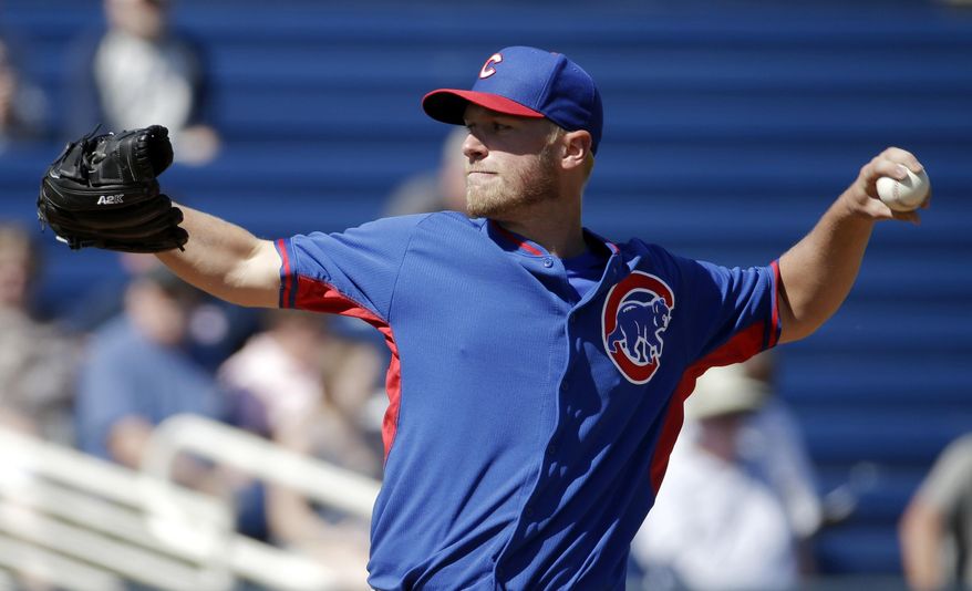 Chicago Cubs' Eric Jokisch throws during the first inning of an exhibition spring training baseball game against the Milwaukee Brewers, Monday, March 3, 2014, in Phoenix. (AP Photo/Morry Gash)