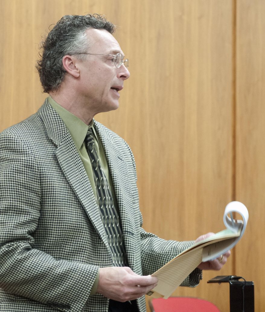 Saginaw County Prosecutor John McColgan addresses the court during the arraignment for Mio Campbell, 30, and Aki C. Dillard, 39, in front of Saginaw County District Judge Kyle Higgs Tarrant, Monday, March 3, 2014. Campbell and Dillard are charged in connection with the injuries police say their 6-year-old son suffered Thursday, Feb. 27. The boy died over the weekend, and prosecutors are awaiting on an autopsy report before amending any charges. (AP Photo/The Saginaw News, Jeff Schrier)