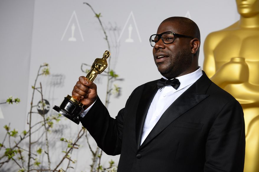 Director Steve McQueen poses in the press room with the award for best picture for "12 Years a Slave" during the Oscars at the Dolby Theatre on Sunday, March 2, 2014, in Los Angeles. (Photo by Jordan Strauss/Invision/AP)