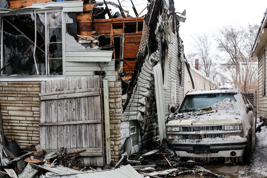 A house is destroyed by fire on Sunday, March 2, 2014 in Detroit. Authorities say an arson suspect has been arrested shortly after fires broke out on four different Detroit streets. Lt. Dennis Richardson, a Detroit arson investigator say that fires were set in four vacant homes starting around 11:15 a.m. Sunday. Two of the fires spread to adjacent homes and one occupied home was destroyed. Richardson says no one was injured. (AP Photo/Detroit Free Press, Jarrad Henderson)