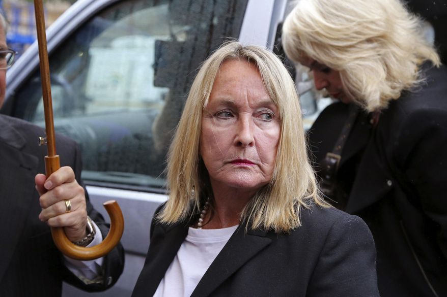 June Steenkamp, the mother of as Reeva Steenkamp, arrives at the high court for the start of the trial of Oscar Pistorius in Pretoria, South Africa, Monday, March 3, 2014. Pistorius is charged with murder with premeditation in the shooting death of girlfriend Reeva Steenkamp in the pre-dawn hours of Valentine's Day 2013. (AP Photo/Schalk van Zuydam)