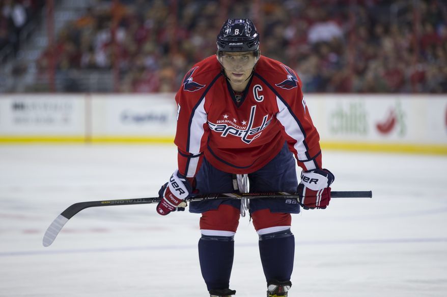 Washington Capitals right wing Alex Ovechkin (8) waits for play to start during the first period of an NHL hockey game against the Philadelphia Flyers on Sunday, March 2, 2014, in Washington. (AP Photo/ Evan Vucci)