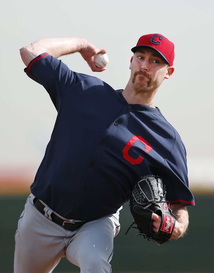 Cleveland Indians pitcher John Axford throws during spring training baseball practice in Goodyear, Ariz., Friday, Feb. 21, 2014. (AP Photo/Paul Sancya)