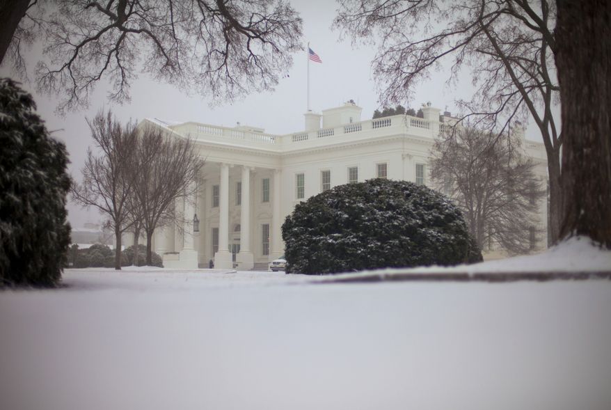 Snow falls at the White House in Washington, Monday, March. 3, 2014, prompting area schools and the federal government to close for the wintry weather. The National Weather Service has issued a Winter Storm Warning for the greater Washington Metropolitan region. (AP Photo/Pablo Martinez Monsivais)