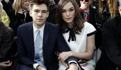 Actress Keira Knightley and her husband James Righton pose as they attend Chanel's ready to wear fall/winter 2014-2015 fashion collection presented in Paris, Tuesday, March 4, 2014. (AP Photo/Thibault Camus)