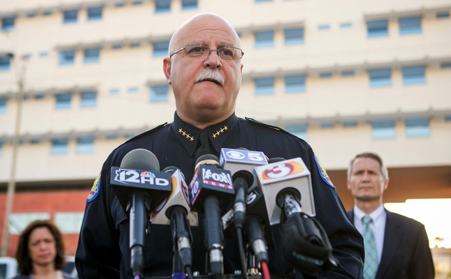 Phoenix police Chief Daniel V. Garcia gives an update outside the emergency room at St. Joseph's Hospital and Medical Center in Phoenix on Monday, March 3, 2014. A Phoenix police officer died and another was in critical condition after a shootout Monday that also killed a man wanted on a felony warrant, authorities said. (AP Photo/The Arizona Republic, Michael Schennum)