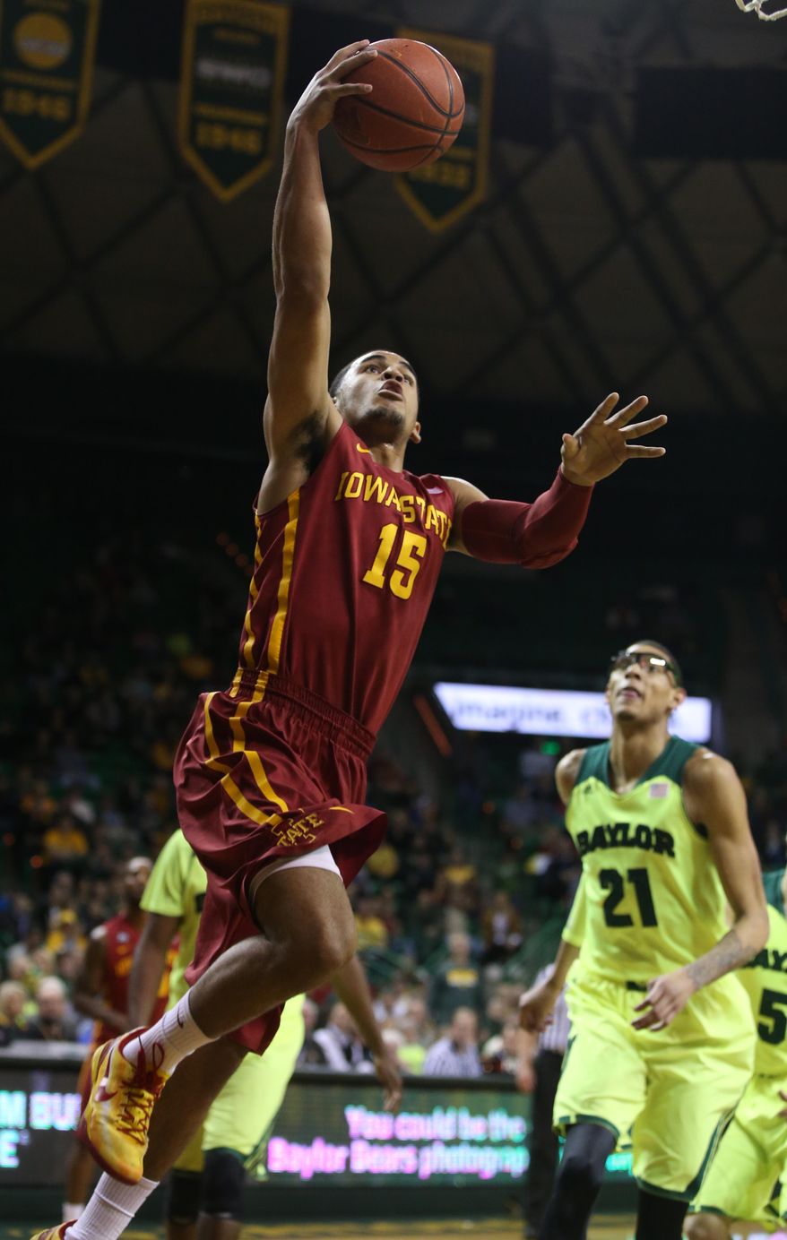 Iowa State guard Naz Long (15) shoots past Baylor center Isaiah Austin (21) during the first half of an NCAA college basketball game, Tuesday, March 4, 2014, in Waco, Texas. (AP Photo/Waco Tribune Herald, Rod Aydelotte)