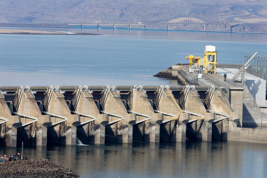 On Monday, March 3, 2014 near Vantage, Wash., the Wanapum Dam spillway support, fourth support from the right, is seen, which has a large crack beneath the water surface that was discovered last week. Columbia River water levels have been lowered up to 20 feet on the upstream side of the dam, in order to relieve stress on the dam. (AP Photo/The Wenatchee World, Don Seabrook)