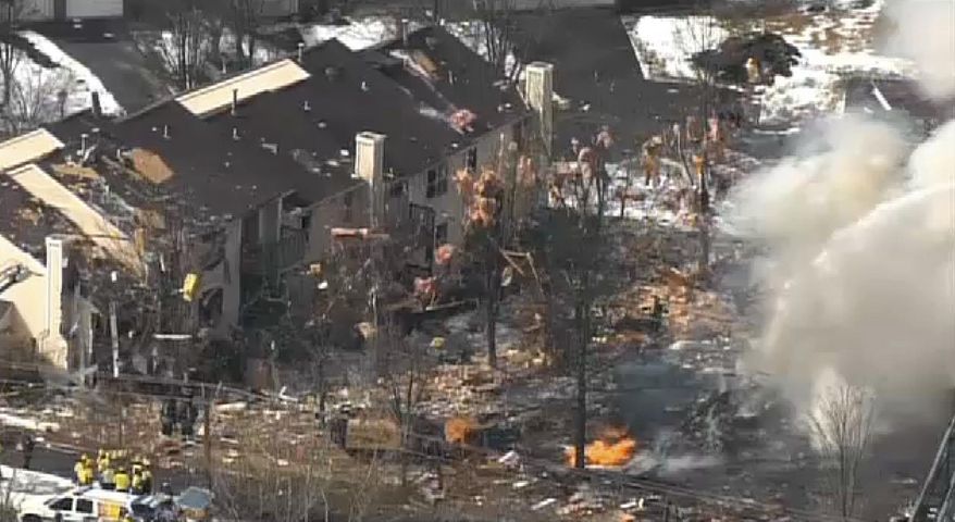 This aerial image taken from video and provided by Fox 29 Philadelphia shows firefighters and rescue personnel working at the scene after an explosion at a townhouse complex Tuesday, March 4, 2014, in Ewing, N.J. (AP Photo/Fox 29 Philadelphia)