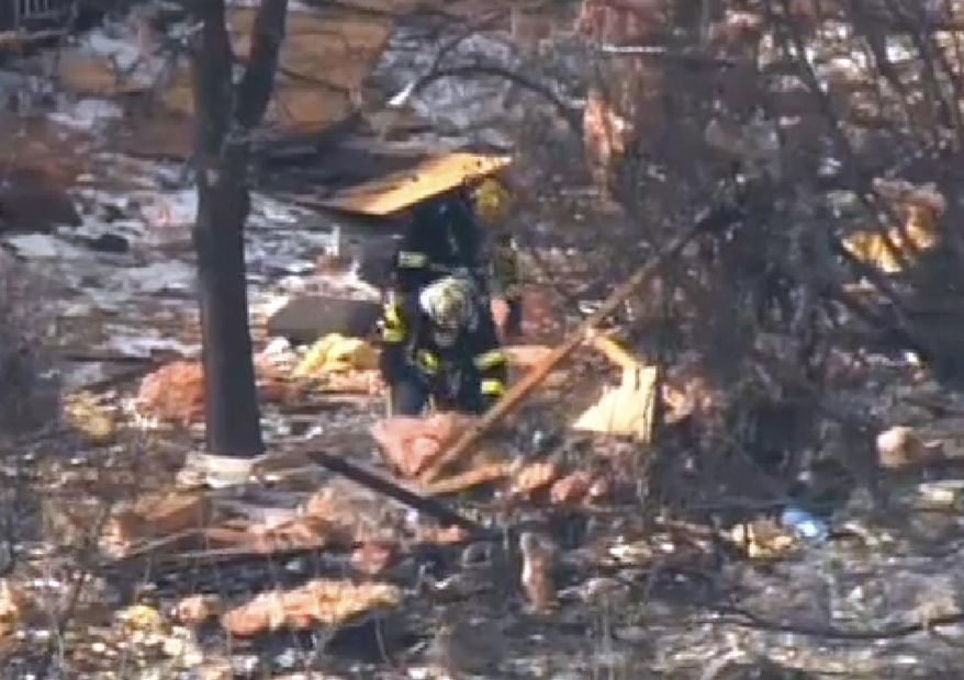 This aerial image taken from video and provided by Fox 29 Philadelphia, shows firefighters and rescue personnel working at the scene after an explosion at a townhouse complex Tuesday, March 4, 2014, in Ewing, N.J. (AP Photo/Fox 29 Philadelphia)