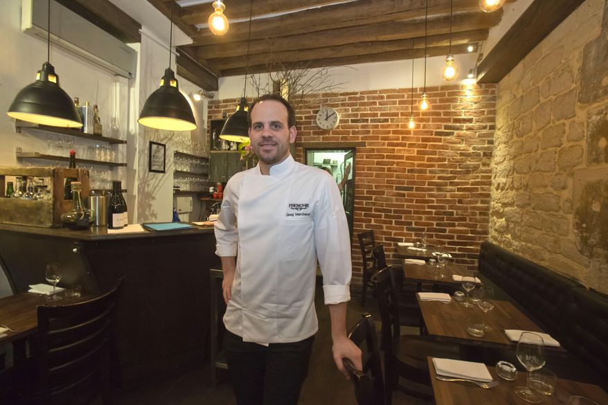 Chef Greg Marchand speaks to the Associated Press during an interview in his restaurant Frenchie in Paris on Thursday, Feb. 13, 2014. "A lot of young chefs - I'm part of it - open a restaurant with no investor, so with not much money. It's often small places, with no designer work because they cannot afford it. But what we have is a craft, knowledge, experience," he said. (AP Photo/Michel Euler)