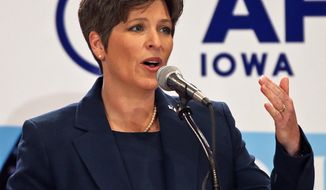 ** FILE ** This Oct. 23, 2013, file photo shows state Sen. Joni Ernst during a Senate debate in Des Moines, Iowa. (AP Photo/The Des Moines Register, Bill Neibergall)