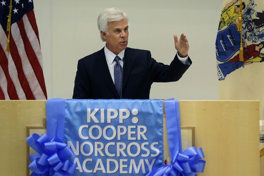George E. Norcross III, addresses a gathering at a groundbreaking ceremony Wednesday, March 5, 2014, in Camden, N.J., for a new kind of school that Norcross' family foundation will help fund. Norcross, a powerful New Jersey Democrat complimented New Jersey Gov. Chris Christie at the groundbreaking ceremony. His kind words came only after he teased Christie about a scandal revolving around traffic jams near the George Washington Bridge. Norcross says he, unlike the governor, has the power to shut down a bridge. The Ben Franklin is closed for a few hours each November for a charity-run sponsored by Norcross. (AP Photo/Mel Evans)
