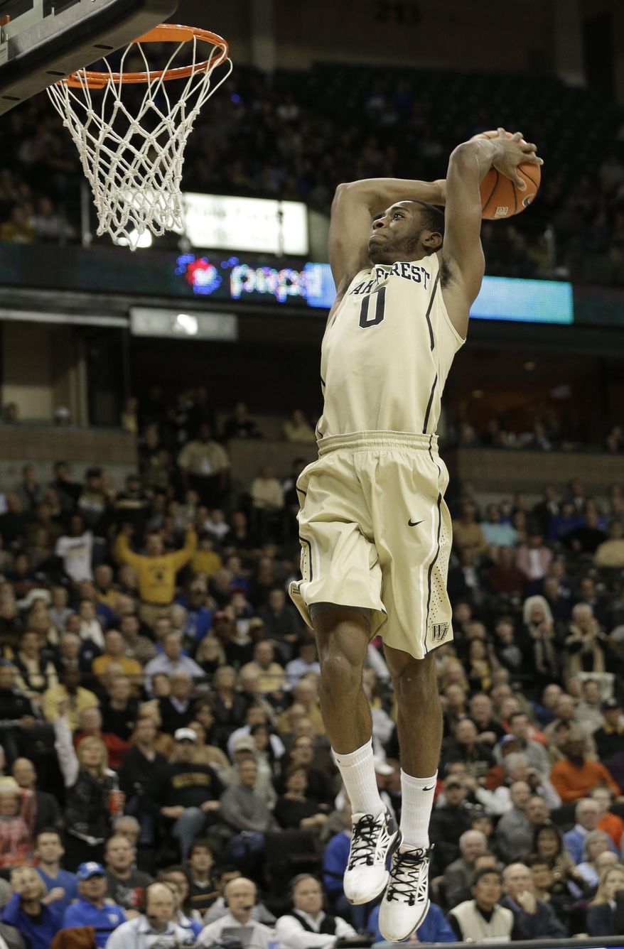 Wake Forest's Codi Miller-McIntyre (0) goes up to dunk against Duke during the first half of an NCAA college basketball game in Winston-Salem, N.C., Wednesday, March 5, 2014. (AP Photo/Chuck Burton)