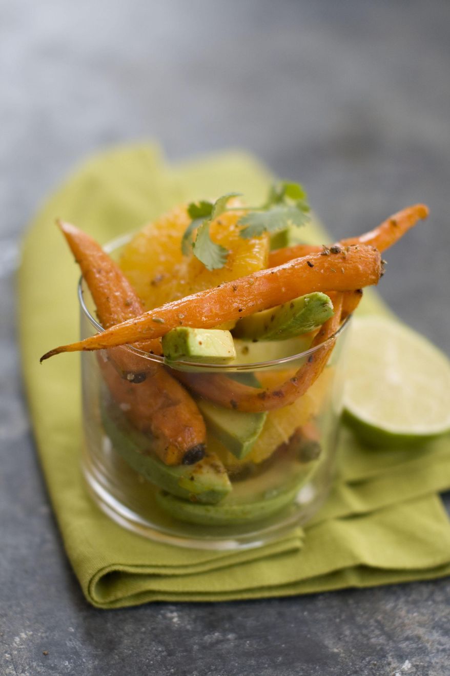 This Feb. 10, 2014 photo shows roasted carrot, orange and avacado salad in Concord, N.H. The recipe is adapted from Greg Marchand's cookbook, "Frenchie." (AP Photo/Matthew Mead)