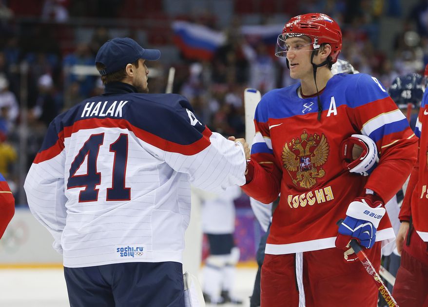 Russia forward Alexander Ovechkin, right, greets Slovakia goaltender Jaroslav Halak at the end of a shootout of a men's ice hockey game at the 2014 Winter Olympics, Sunday, Feb. 16, 2014, in Sochi, Russia. Russia won 1-0. (AP Photo/Mark Humphrey)