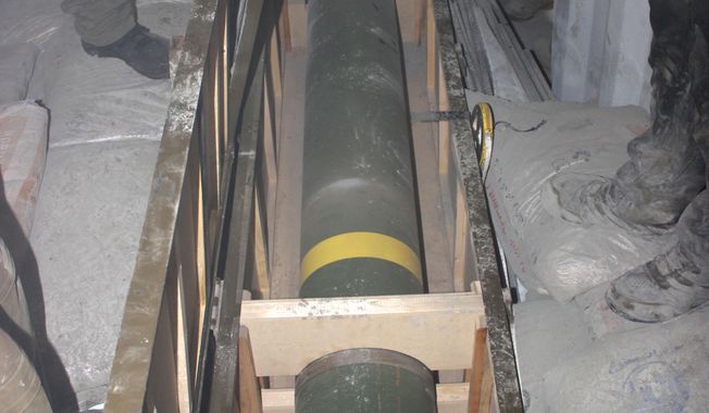 This photo released by the Israel Defense Forces shows a missile on an intercepted ship in the Red Sea Wednesday, March 5, 2014. Israeli naval forces raided a ship deep in the Red Sea early Wednesday and seized dozens of advanced rockets from Iran destined for Palestinian militants in Gaza, the military said. (AP Photo/IDF)