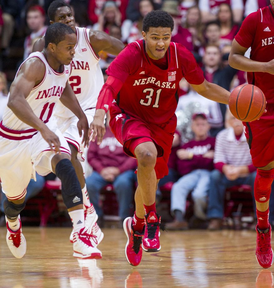 Nebraska’s Shavon Shields (31) races the ball past Indiana's Yogi Ferrell (11) up court in an effort to get off a last-second shot in the first half of an NCAA college basketball game, Wednesday, March 5, 2014, in Bloomington, Ind. (AP Photo/Doug McSchooler)