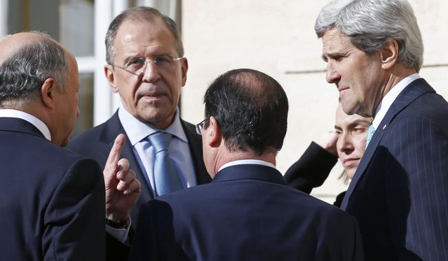 From left, French Foreign Minister Laurent Fabius, Russian Foreign Minister Sergey Lavrov, French President Francois Hollande, Italian Foreign Minister Federica Mogherini and U.S. Secretary of State John Kerry, talk together during a break of a meeting at the Elysee Palace in Paris, Wednesday, March 5, 2014. Top diplomats from the West and Russia trying to find an end to the crisis in Ukraine are gathering in Paris on Wednesday as tensions simmered over the Russian military takeover of the strategic Crimean Peninsula. (AP Photo/Alain Jocard, Pool)