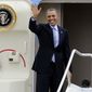 **FILE** President Obama waves before his departure on Air Force One from Bradley Air National Guard Base in East Granby, Conn., on March 5, 2014. Obama, who was heading to Boston, was in Connecticut to talk about increasing the federal minimum wage. (Associated Press)
