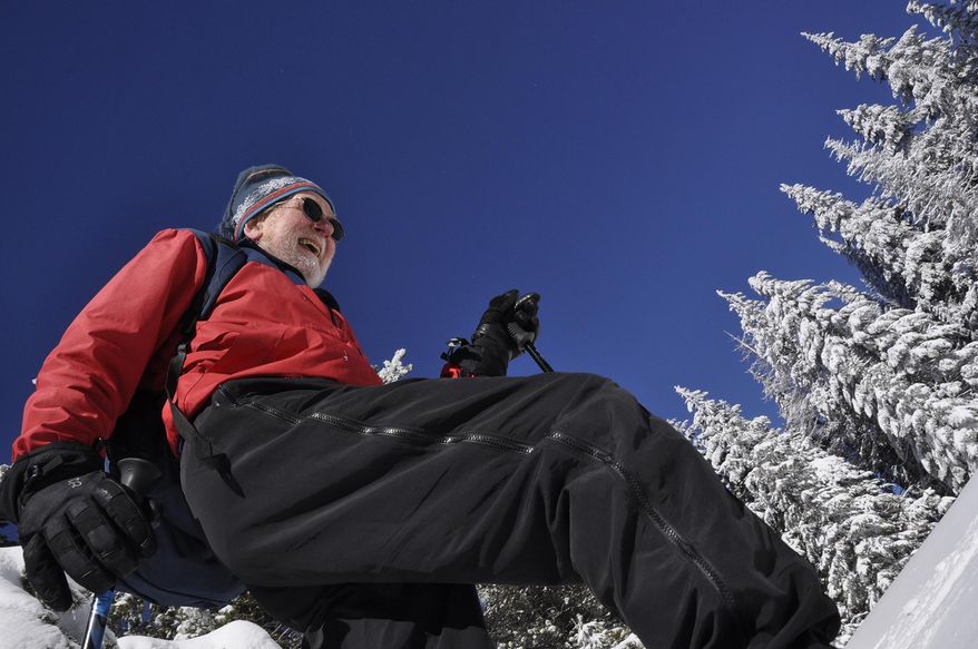 Art Bookstrom, 75, breaks trail on a cross-country skiing route he marked with orange triangles for the enjoyment of skiers who want an old-fashioned nordic skiing experience off the wide, groomed trails at Mount Spokane State Park. (AP Photo/The Spokesman-Review, Rich Landers)