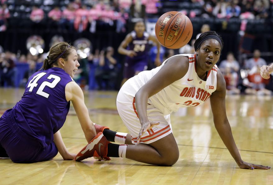 Ohio State center Darryce Moore, right, loses the ball as she goes to the floor with Northwestern guard Karly Roser in the first half of an NCAA college basketball game in the opening round of the Big Ten Tournament in Indianapolis, Ind., Thursday, March 6, 2014. (AP Photo/Michael Conroy)