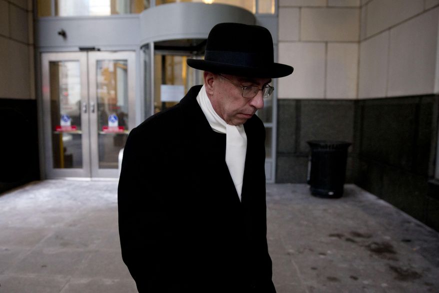 The Rev. Andrew McCormick walks from the center for criminal justice Thursday, March 6, 2014, in Philadelphia. The Roman Catholic priest accused of molesting an altar boy briefly took the stand Wednesday to deny the 1997 encounter, but acknowledged being reprimanded twice for having children in his private living quarters. (AP Photo/Matt Rourke)