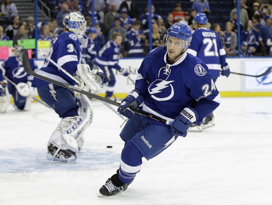New Tampa Bay Lightning right wing Ryan Callahan (24) skates during warm ups before an NHL hockey game Thursday, March 6, 2014, in Tampa, Fla. Callahan was acquired by the Lighting in a trade with the New York Rangers for Martin St. Louis. (AP Photo/Chris O'Meara)