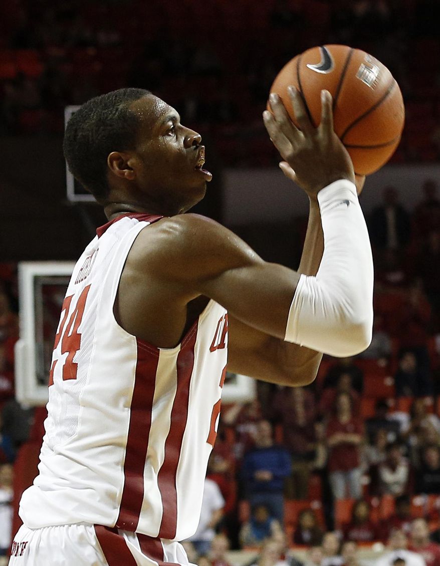 Oklahoma's Buddy Hield (24) takes a shot during an NCAA game between Oklahoma and West Virginia at the Lloyd Noble Center in Norman, Okla., Wednesday, March 5, 2014. (AP Photo/Garett Fisbeck)