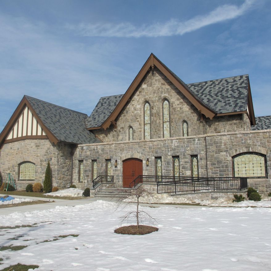 This Tuesday, Feb. 4, 2014 photo shows Refugio de Esperanza (Refuge of Hope) church in New Rochelle, N.Y. The church, vacant and deteriorating for decades, has been renovated with the help of retired New York Yankees pitcher Mariano Rivera. Clara Rivera, his wife, is to be the head pastor of the new congregation. (AP Photo/Jim Fitzgerald)