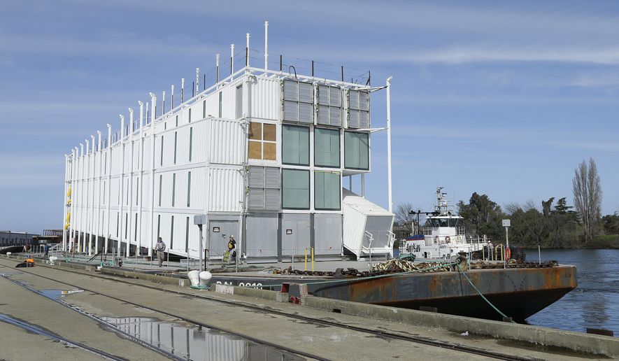 The Google barge is seen moored at the Port of Stockton Thursday, March 6, 2014, in Stockton, Calif. Google's mystery barge has arrived at its new home in the California delta after the Internet company was ordered to move it from San Francisco. The odd-looking, four-story vessel made of recycled shipping containers departed from Treasure Island to comply with a Jan. 31 regulatory order concluding that Google Inc. didn't have the proper permits to build it there. Construction stopped on the project late last year. Google says the barge will serve as an interactive technology center when it's done. (AP Photo/Ben Margot)