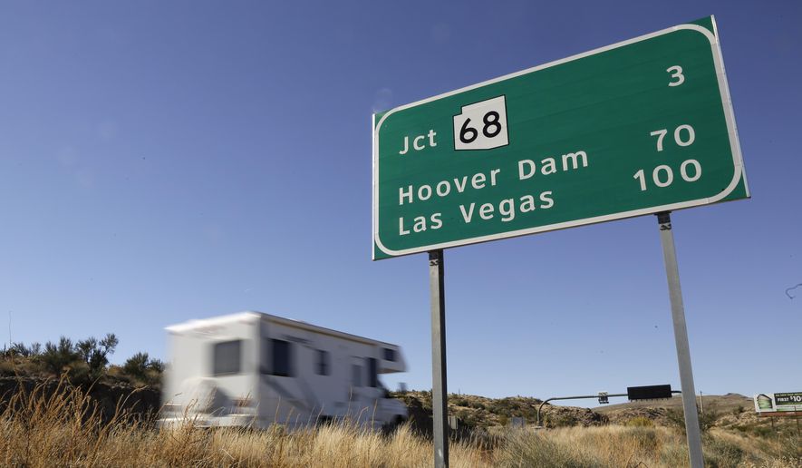 In this Friday, Nov. 8, 2013 photo, motorists head northbound on U.S. Highway 93, in Kingman, Ariz. (AP Photo/Julie Jacobson)