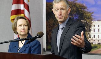 Sen. Roger Reinert, right, of Duluth, and Rep. Jenifer Loon of Eden Prairie, unveiled new plans to repeal the Sunday prohibition of liquor sales in Minnesota during a news conference at the state Capitol, Thursday, March 6, 2014, in St. Paul, Minn. Many mom-and-pop liquor stores oppose Sunday sales because they say it forces them for competitive reasons to be open a seventh day of the week without increasing profits. Their lobbying has been influential in keeping the ban in place. (AP Photo/Jim Mone)