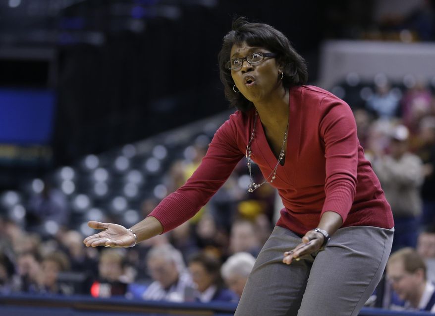 Wisconsin head coach Bobbie Kelsey questions the lack of a call in the second half of an NCAA college basketball game against Minnesota in the opening round of the Big Ten Tournament in Indianapolis, Ind., Thursday, March 6, 2014. Minnesota defeated Wisconsin 74-68 in overtime. (AP Photo/Michael Conroy)