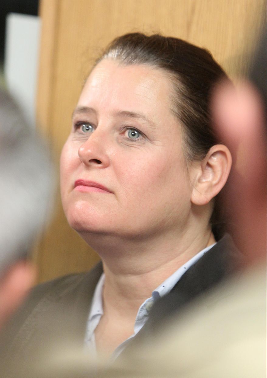 CORRECTS TO JUDGE HAMILTON, NOT COLLINS IN SECOND SENTENCE - Colleen Middleton, the mother of victim Robert Middleton, speak to the media after hearing regarding Don Willburn Collins at the 359th Judicial District Court with Judge Kathleen Hamilton on Thursday, March 6, 2014, in Conroe, Texas. Collins, now 28, accused of dousing Middleton with gasoline and setting him on fire in 1998 when he was a teenager, can be tried as an adult for murder after the victim died from his burns nearly 13 years later, Judge Hamilton ruled Thursday. (AP Photo/ The Courier, Jason Fochtman) MANDATORY CREDIT