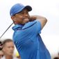 Tiger Woods hits from the second tee during the first round of the Cadillac Championship golf tournament Thursday, March 6, 2014, in Doral, Fla. (AP Photo/Marta Lavandier)