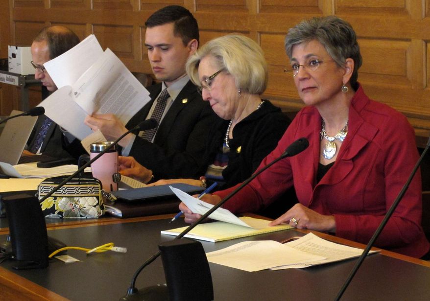 Kansas Senate President Susan Wagle, right, a Wichita Republican, joins members of the Senate Judiciary Committee for a hearing on whether the state needs additional legal protections for people, groups and businesses opposing gay marriage, Thursday, March 6, 2014, at the Statehouse in Topeka, Kan. The other senators are, right to left, Pat Pettey, a Kansas City Democrat; Garrett Love, a Montezuma Republican, and Forrest Knox, an Altoona Republican. (AP Photo/John Hanna)