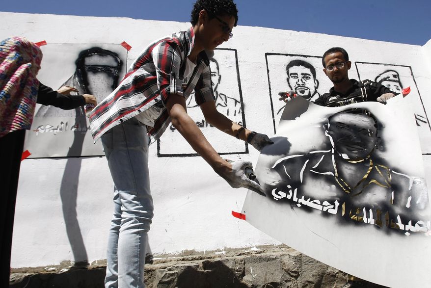 Yemeni graffiti artists and activists paint faces of victims of the al-Qaida militant attack that occurred in the Defense ministry complex on Dec. 5, 2013, on a wall during an &amp;quot;anti-terrorism&amp;quot; campaign in Sanaa, Yemen, Thursday, March 6, 2014. Several Yemeni security officials recently said that al-Qaida has spread to operate in every province of the country of more than 25 million. Al-Qaida in the Arabian Peninsula, as the Yemen branch is known, has demonstrated its capabilities with a sophisticated and brutal attack in December on the Defense Ministry in the capital, Sanaa, that killed more than 50 people. (AP Photo/Hani Mohammed)