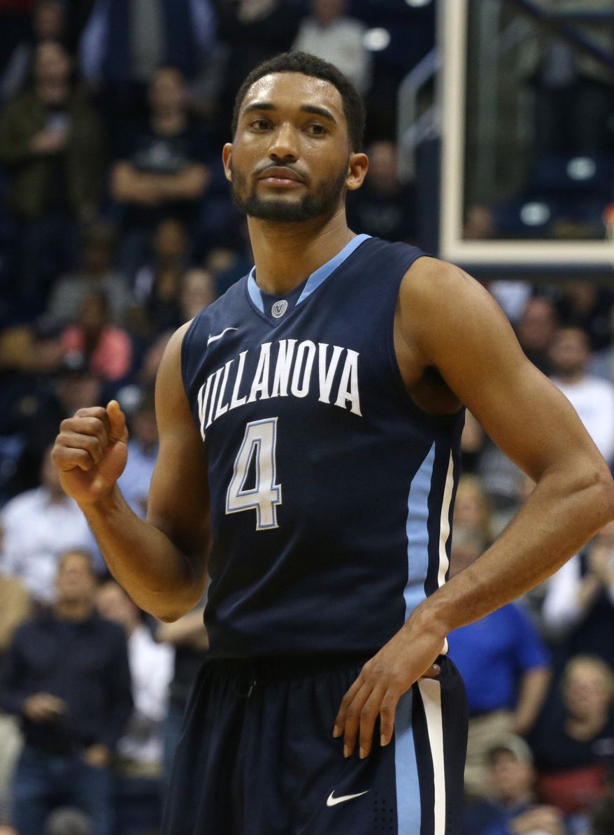 Villanova's Darrum Hilliard rpumps his fist near the close of an NCAA college basketball game against Xavier in Cincinnati on Thursday, March 6, 2014. Villanova won 77-70. (AP Photo/Tom Uhlman)