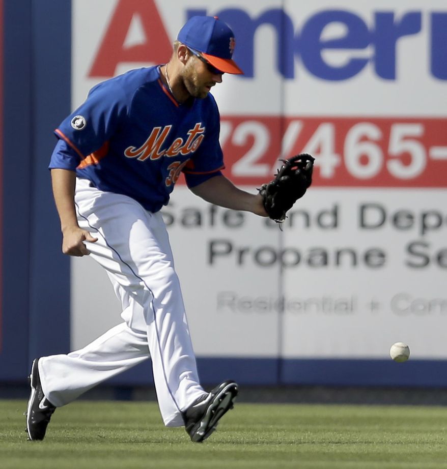 New York Mets left fielder Andrew Brown drops a ball hit by St. Louis Cardinals' Jon Jay during the sixth inning of an exhibition spring training baseball game Friday, March 7, 2014, in Port St. Lucie, Fla. Jay ended up at second and Brown was charged with an error on the play. (AP Photo/Jeff Roberson)