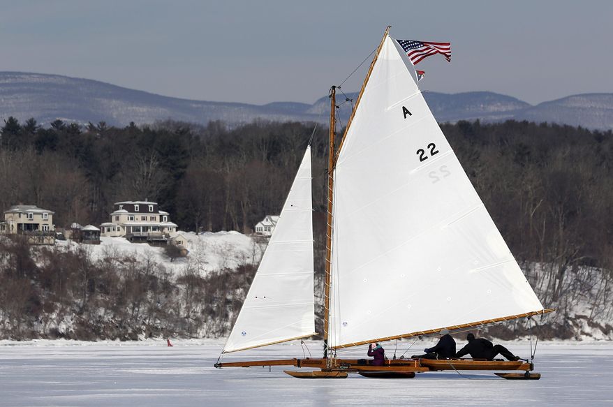 An ice boat sails along the Hudson River on Saturday, March 1, 2014, in Barrytown, N.Y. This year’s frigid winter has created excellent conditions for ice sailing on the Hudson River in New York. (AP Photo/Mike Groll)