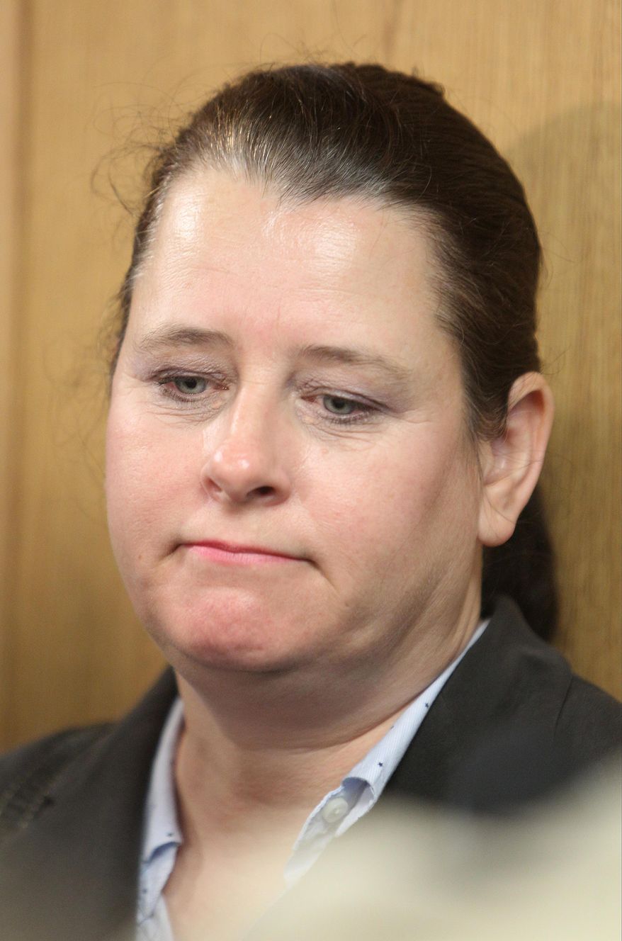 CORRECTS TO JUDGE HAMILTON, NOT COLLINS IN SECOND SENTENCE - Colleen Middleton, the mother of victim Robert Middleton, speak to the media after hearing regarding Don Willburn Collins at the 359th Judicial District Court with Judge Kathleen Hamilton on Thursday, March 6, 2014, in Conroe, Texas. Collins, now 28, accused of dousing Middleton with gasoline and setting him on fire in 1998 when he was a teenager, can be tried as an adult for murder after the victim died from his burns nearly 13 years later, Judge Hamilton ruled Thursday. (AP Photo/ The Courier, Jason Fochtman) MANDATORY CREDIT