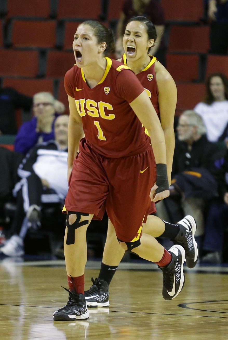 Southern California's Jordan Adams (1) and Kiki Alofaituli, right, celebrate at the buzzer after defeating Arizona State 59-57 in an NCAA college basketball game in the second round of the Pac-12 women's tournament on Friday, March 7, 2014, in Seattle. (AP Photo/Ted S. Warren)
